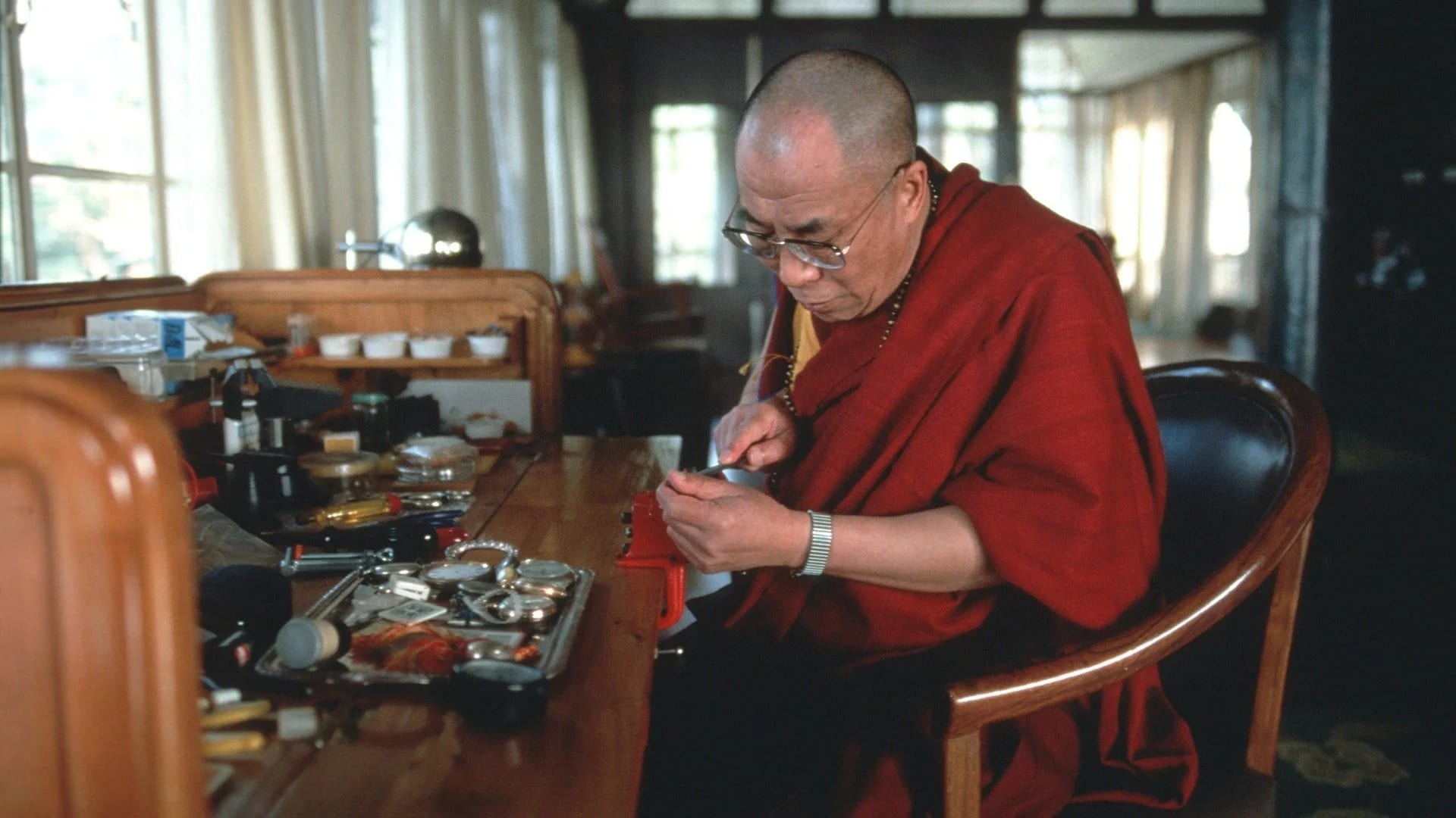 Dalai Lama repairing watches